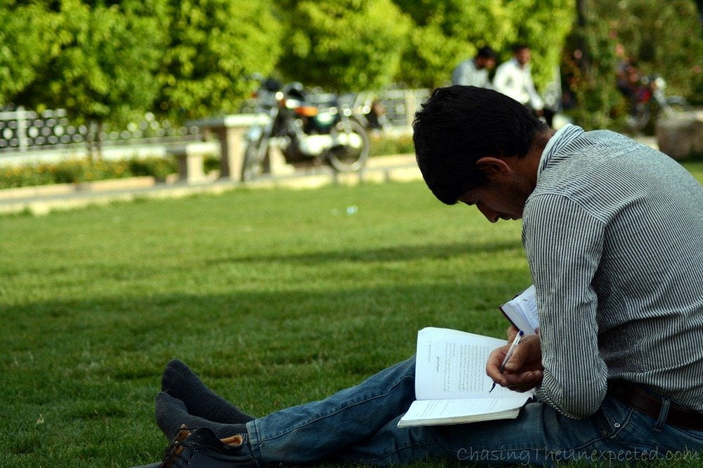Student doing his homework in the park
