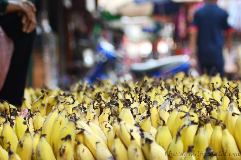 Bananas with the market as a background